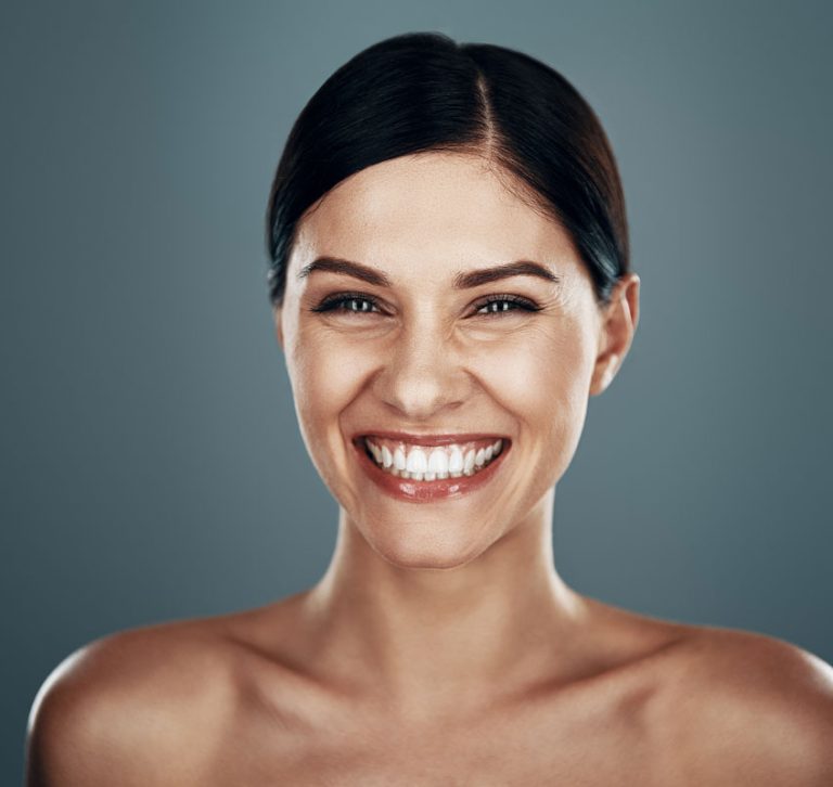 Smiling patient after premium dental care